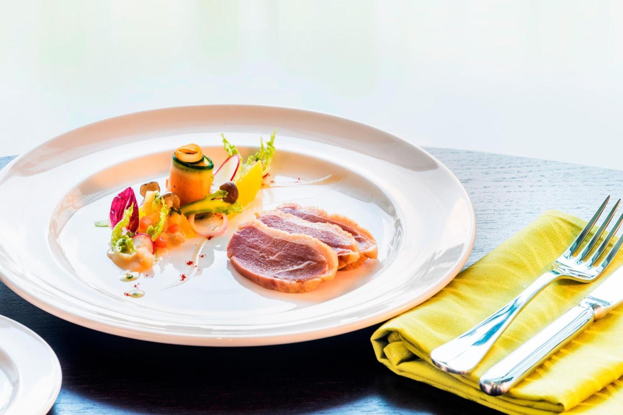 Le Meridien Putrajaya Exteriér fotografie A plate of duck confit